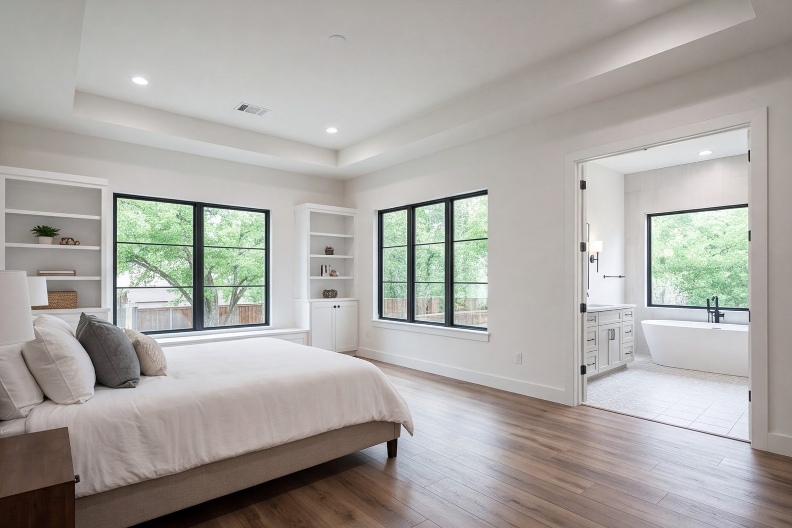 Wedgwood primary bedroom suite addition with a wide bath beyond, matching the original brick